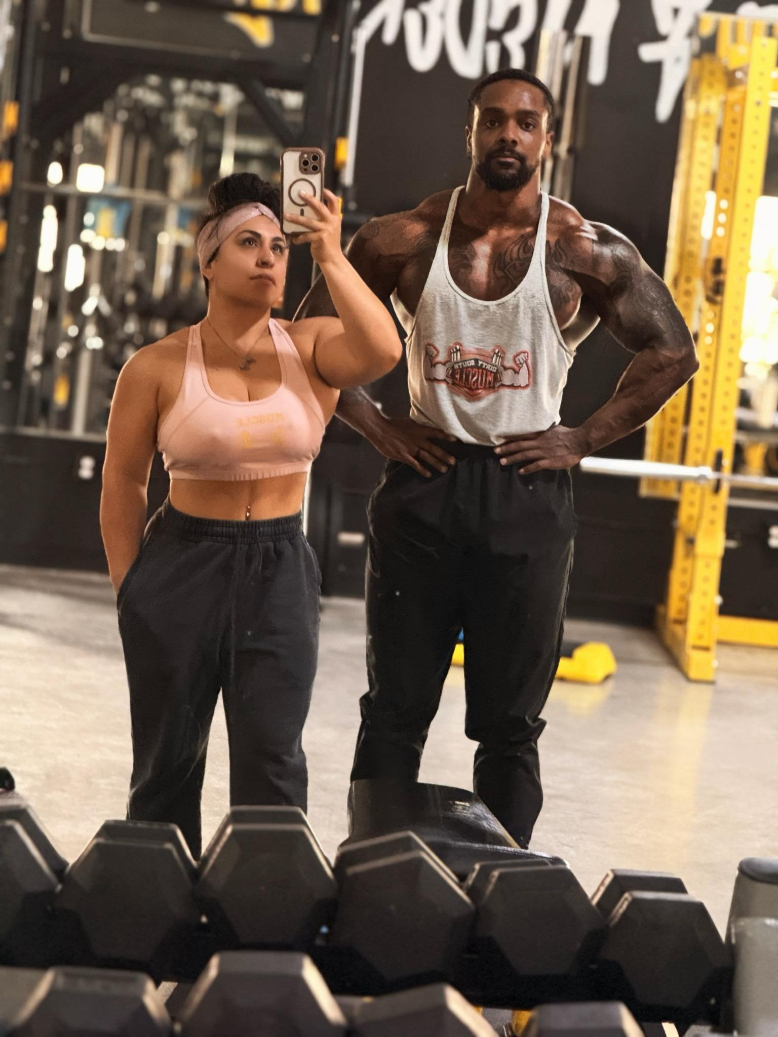 Muscle Warehouse members training on the gym floor